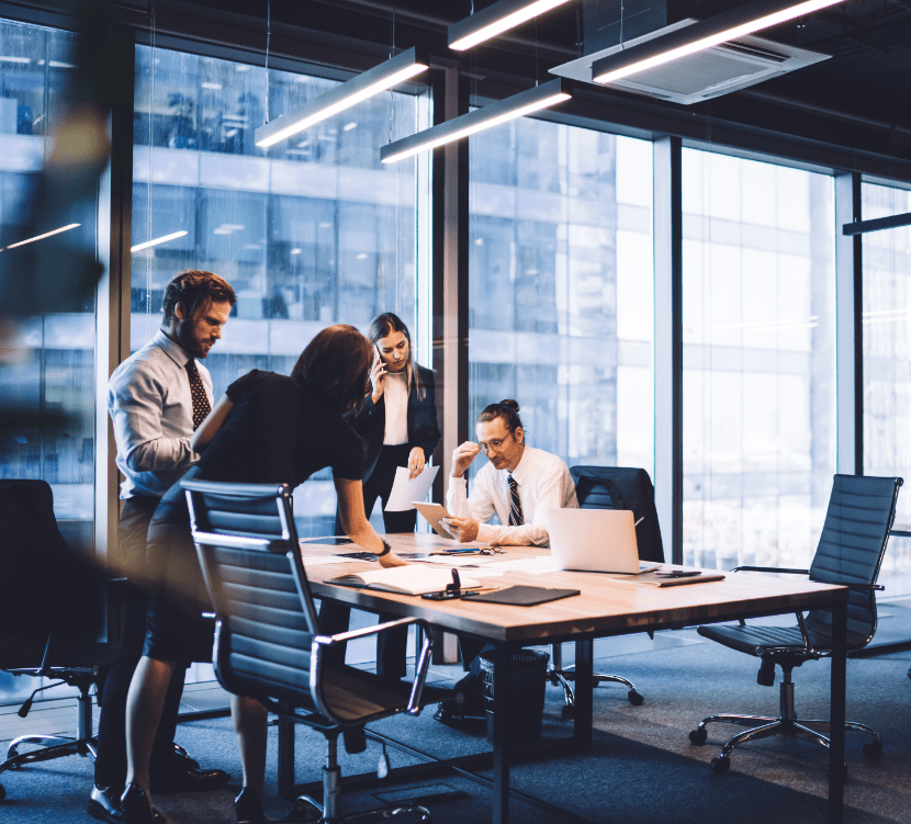 Team discussing work in conference room