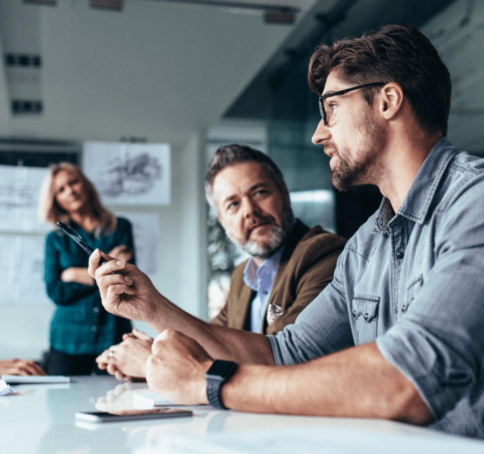 Man describing ideas to team at meeting